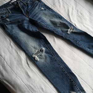 Distressed skinny jeans.